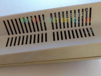 Peritel Atari 400 Left-side ventilation grids with visible PERITEL adaptor card and fixation screw